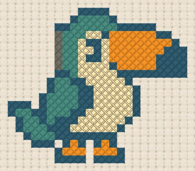 Toucan finished in cross stitch on Aida cloth