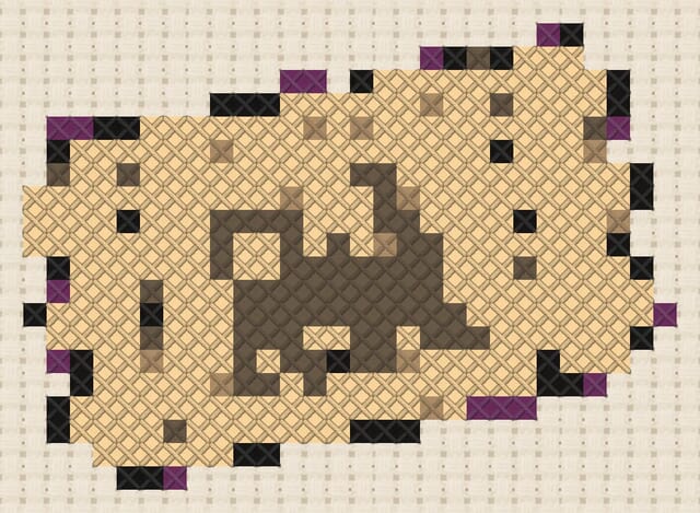 Train ticket finished in cross stitch on Aida cloth