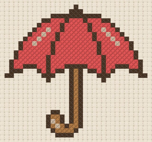 Umbrella finished in cross stitch on Aida cloth