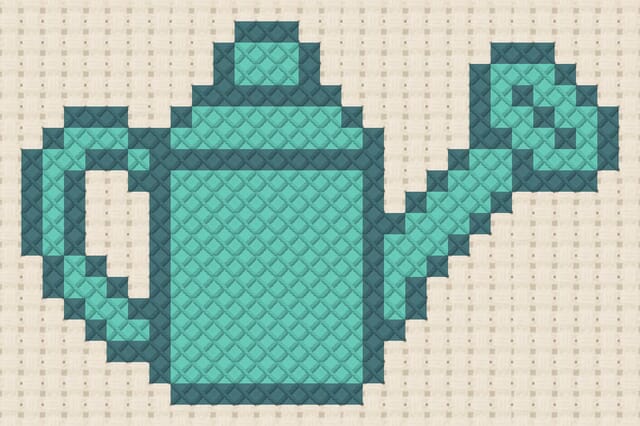 Watering can finished in cross stitch on Aida cloth