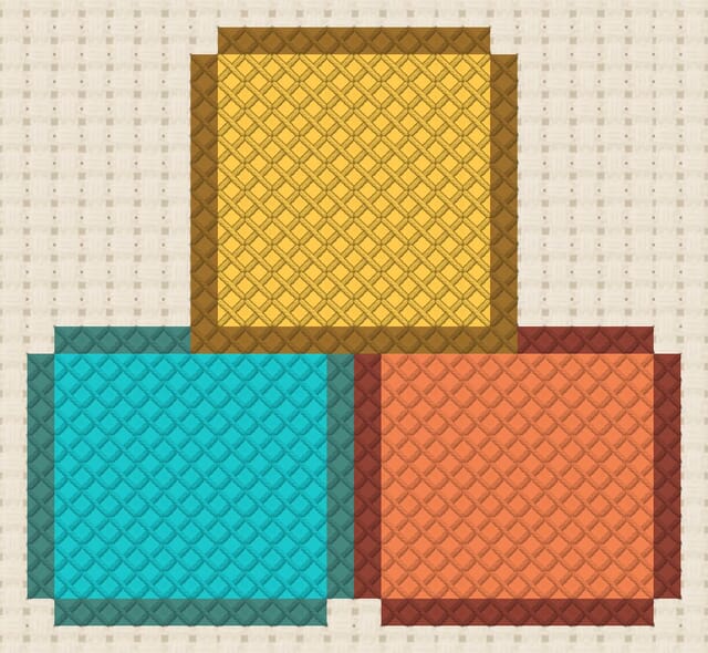 Wooden blocks finished in cross stitch on Aida cloth