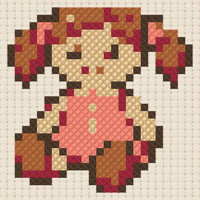 Wooden doll finished in cross stitch on Aida cloth