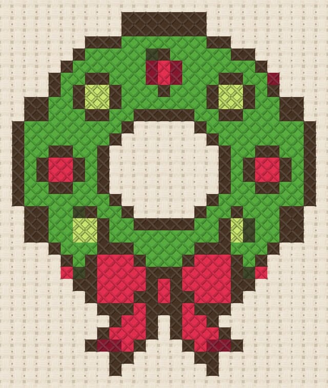 Wreath finished in cross stitch on Aida cloth