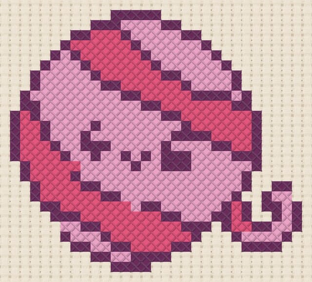 Yarn ball finished in cross stitch on Aida cloth